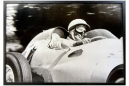 Large Black and White Signed Photo of Sir Stirling Moss in His Cooper c.1957