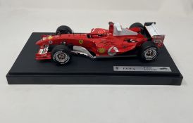 Michael Schumacher-Signed 1:18th Scale Ferrari F2004 Model in a Display Cabinet