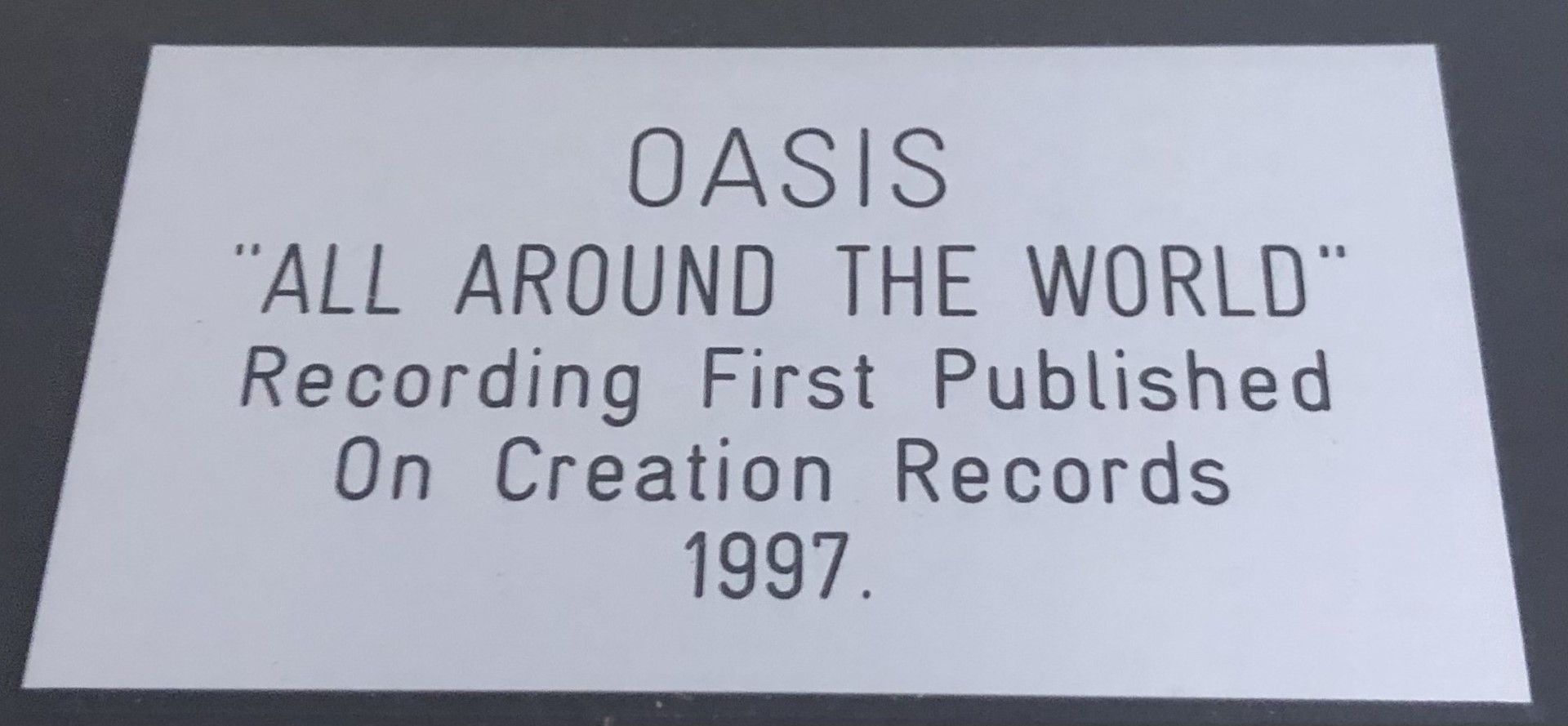1 x Framed OASIS Silver 7 Inch Vinyl Record - ALL AROUND THE WORLD - Image 2 of 4