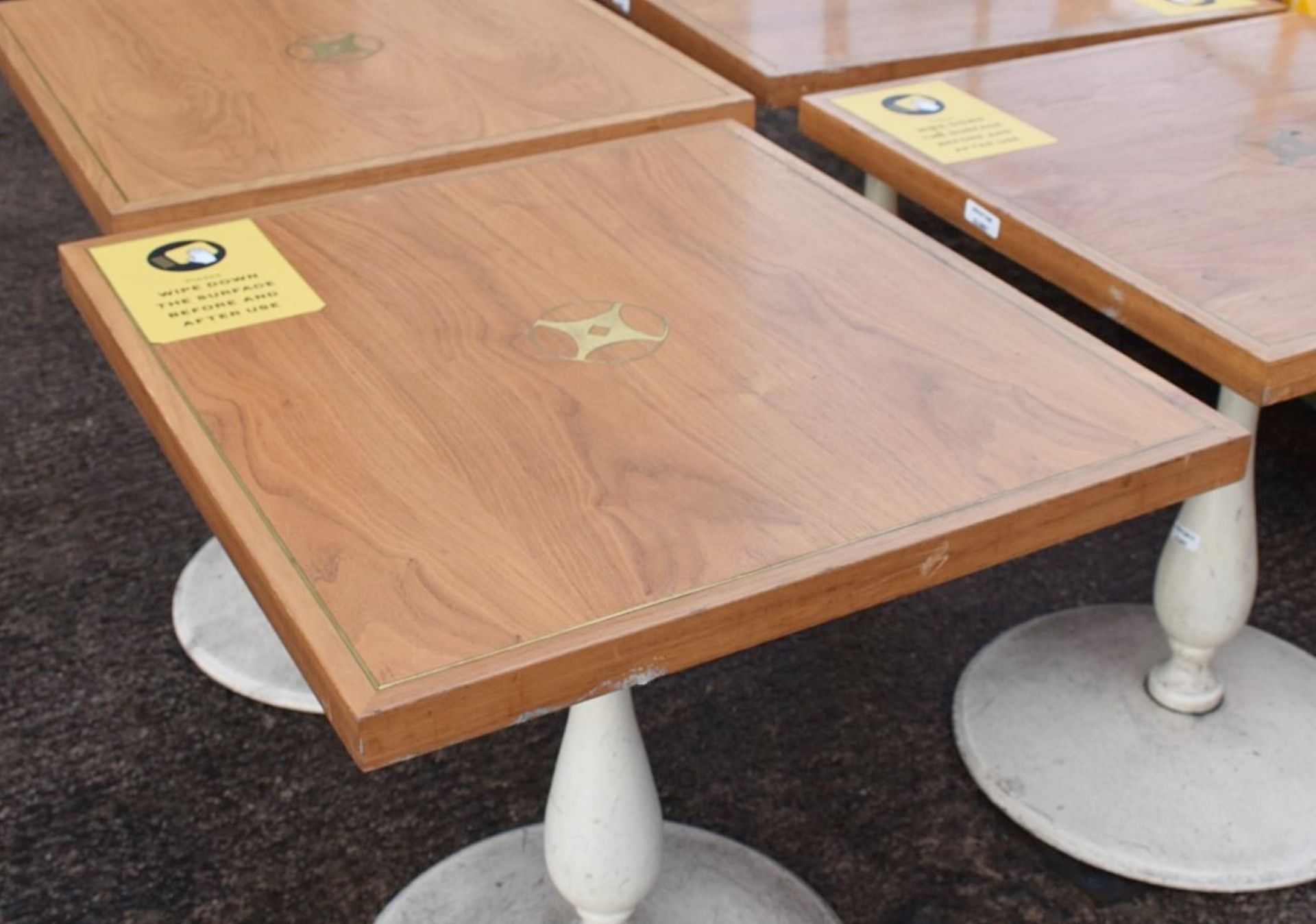 4 x Wooden Topped Bistro Tables Featuring Inlaid Brass Work And Sturdy Metal Bases - Image 7 of 7