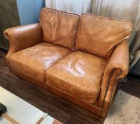 1 x Carlton Vintage Tan Leather Upholstered 2-Seater Sofa - Recently Removed from a Luxury Furniture