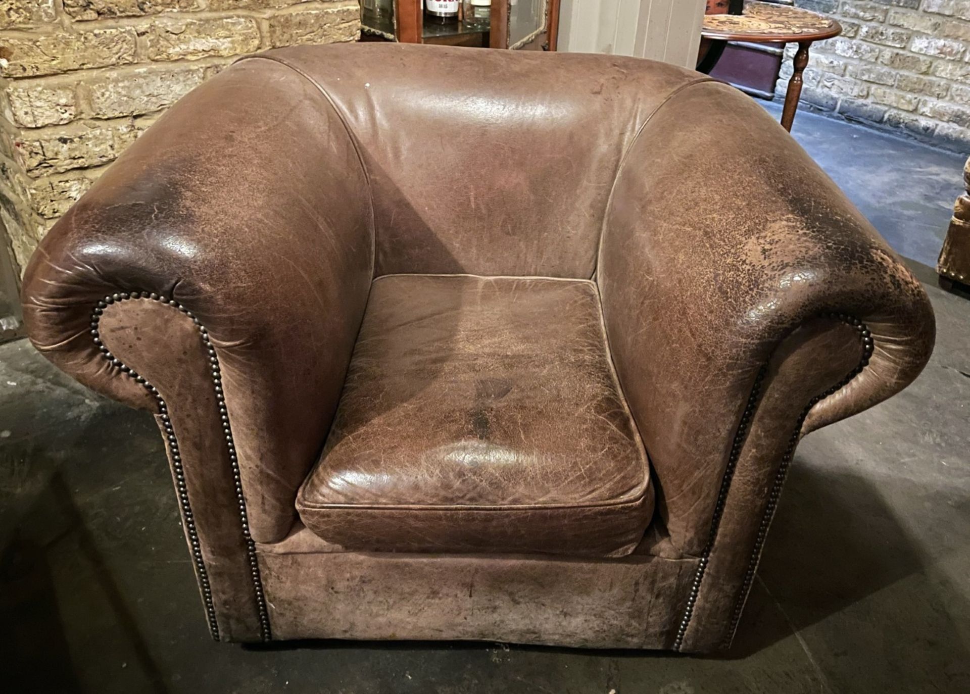1 x Vintage Large Brown Sheepskin Leather Armchair with a Distressed Aesthetic and Studded Detailing - Image 2 of 8
