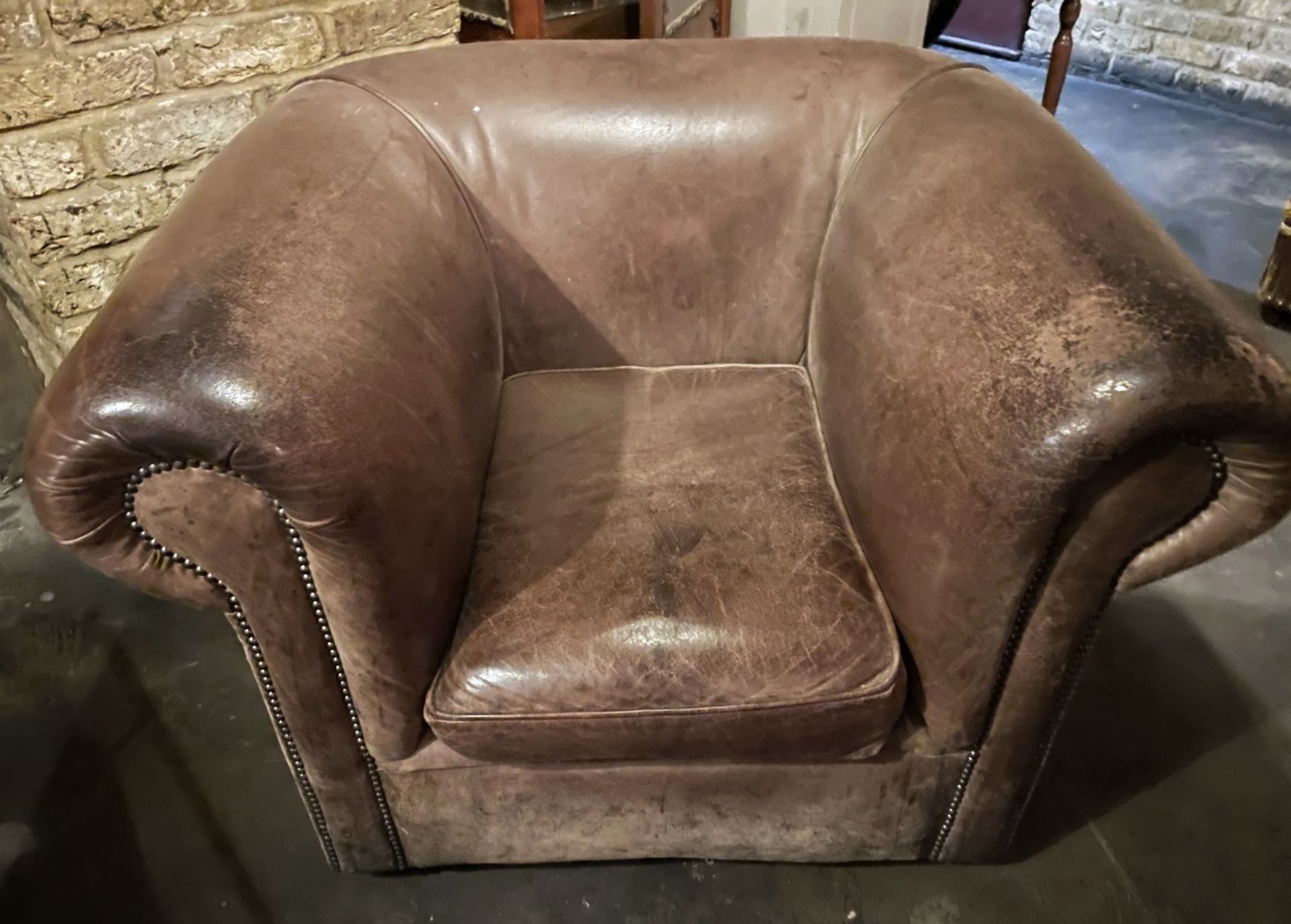 1 x Vintage Large Brown Sheepskin Leather Armchair with a Distressed Aesthetic and Studded Detailing - Image 8 of 8