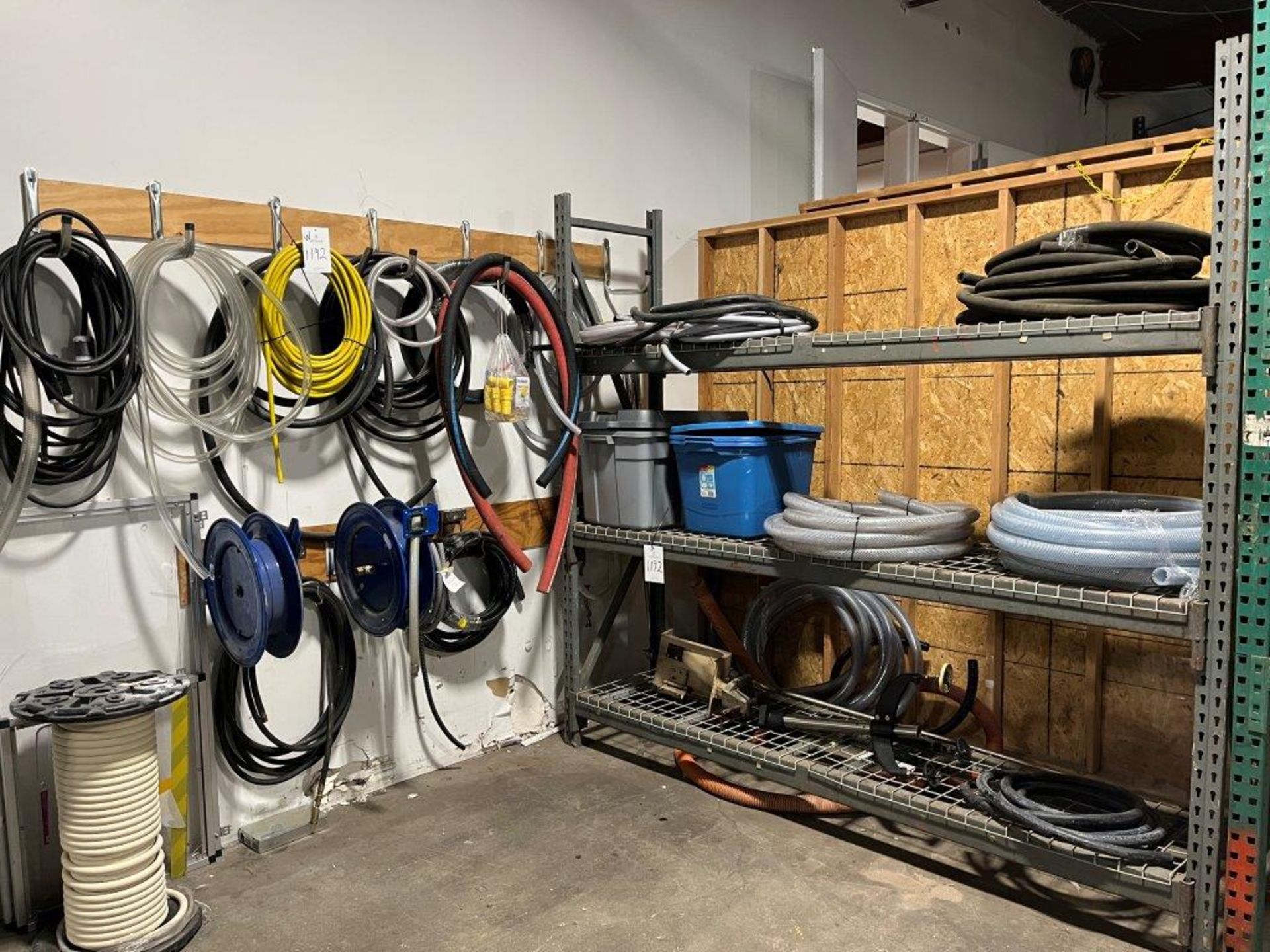 Lot of Assorted Hose to Include (2) Hose Reels and Pallet Rack