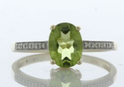 9ct Yellow Gold Diamond And Peridot Ring (P1.28) 0.04 Carats - Valued By IDI £1,345.00 - An oval 8mm