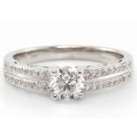 18ct White Gold Single Stone Diamond Ring With Double Chanel Set Shoulders (0.70) 0.83 Carats -