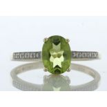 9ct Yellow Gold Diamond And Peridot Ring (P1.28) 0.04 Carats - Valued By IDI £1,345.00 - An oval 8mm