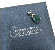 **NO RESERVE** 9K WHITE GOLD DIAMOND AND EMERALD PENDENT, SET WITH 1.60 CARAT EMERALD, SI/G, INCLUDE