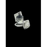 14k white gold ring set with 2.03 carat cushion cut stone and 0.65 diamonds in the shank