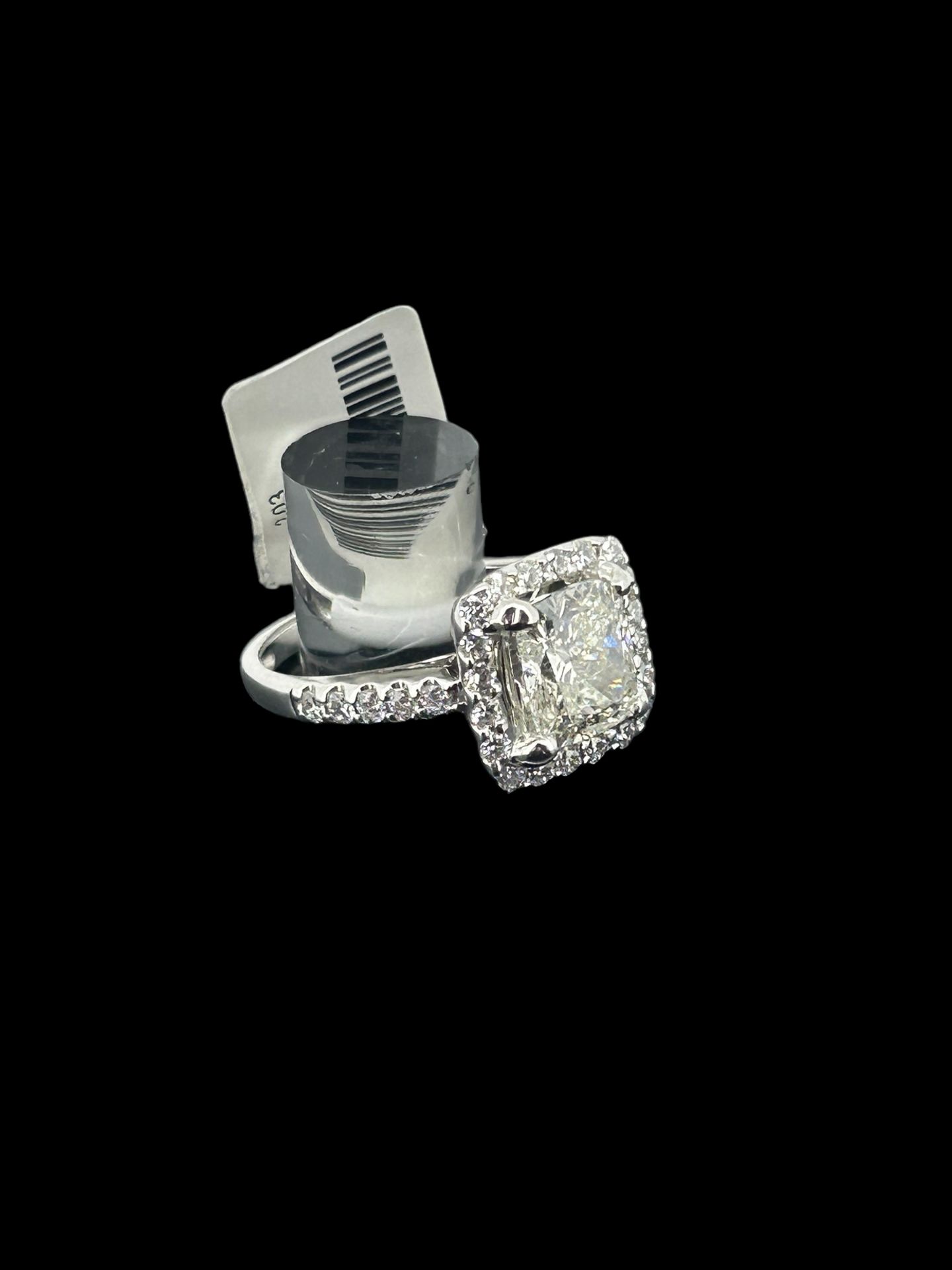14k white gold ring set with 2.03 carat cushion cut stone and 0.65 diamonds in the shank
