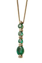 An 18ct yellow gold emerald and diamond pendant necklace, set with three round-cut emeralds approx