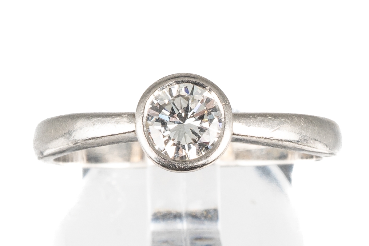 A platinum and diamond solitaire ring, set with a round brilliant-cut diamond approx 0.35ct in a - Image 2 of 5