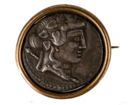 A Greek silver coin, mounted in yellow metal brooch fitting In good condition