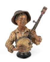 An antique cold painted bronze banjo player c.1910, unmarked, approx 21cm tall In good condition but