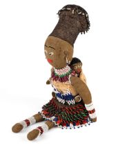 A vintage South African beaded felt doll, of a mother and a child, approx 43cm high Some minor