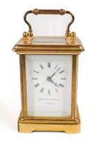 A 20th century Swiss brass carriage clock by Matthew Norman, white enamel dial with Roman