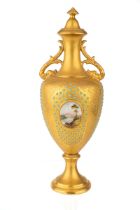 A Coalport jewelled and scene painted pedestal vase and cover, twin handled baluster form, decorated