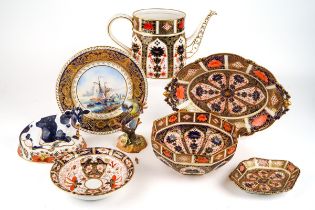 A collection of Royal Crown Derby porcelain including tea pot, bowls, paper weight and Blue Tit,