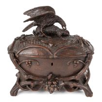 19th century Black Forest carved velvet lined wooden casket, mounted with an eagle attacking a hare.