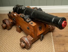 An English solid cast iron cannon, believed to come from HMS Drake. Repainted approximately 40 years