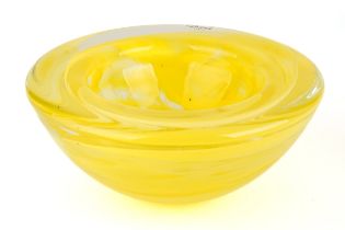 A yellow Kosta Boda bowl with swirl design, 17.5cm diameter, 8cm high, with original label on In