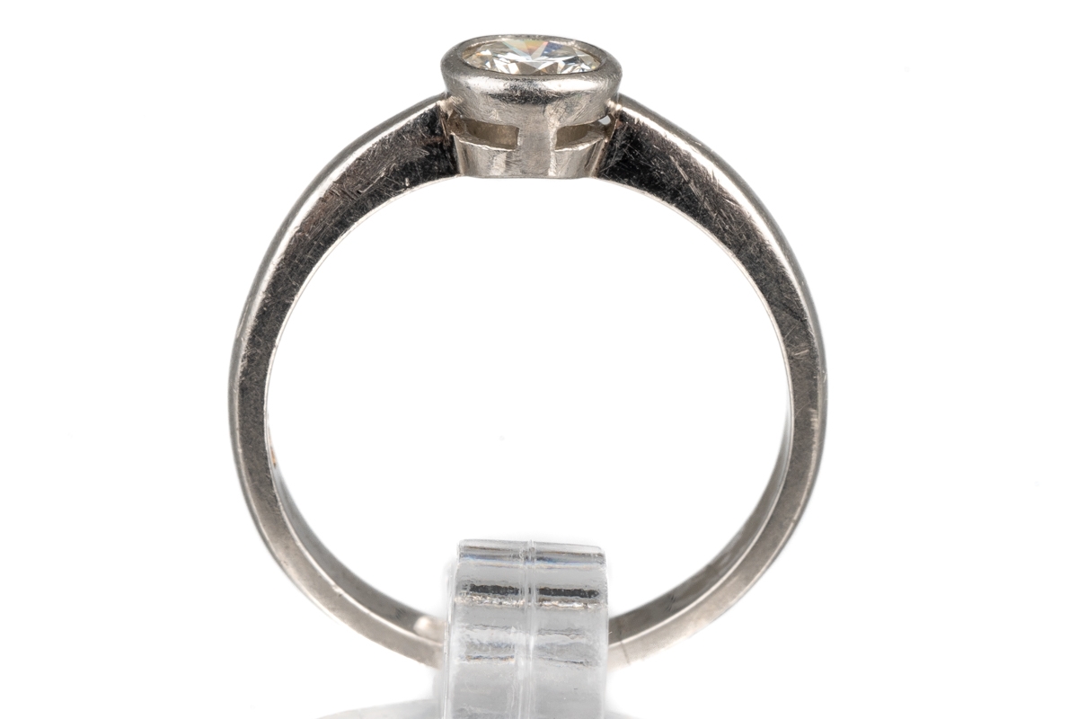 A platinum and diamond solitaire ring, set with a round brilliant-cut diamond approx 0.35ct in a - Image 3 of 5