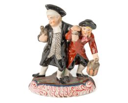 A Staffordshire Pearlware glazed earth ware figure group of The Vicar and Moses, circa 1800, with