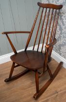 An Ercol elm and beech Goldsmith rocking chair, 84 cm tall. Some wear to arms and rockers. In good