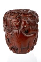 A Chinese / Japanese carved wooden box and cover, carved in the round with Chinese zodiac animals,
