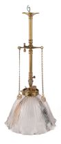 An antique converted brass pendant gas lamp original Holophane glass shade, rewired. The lamp has