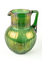 An early 20th Century Loetz Neptune pattern green lustre water jug, the body relief molded with a