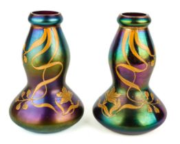 A pair of Harrach iridescent Art Nouveau vases, with raised gilt decoration, circa 1900, approx 18.