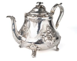 An early Victorian silver teapot, the hinged domed cover with floral finial, the body embossed