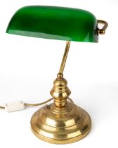A brass Bankers style desk lamp. Green glass shade, stands approx. 40 cm tall. Plug is detached,