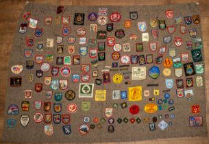 Scouting interest. A Scout blanket, circa 1960s/70s, applied with a large collection of badges
