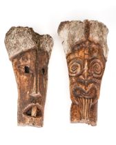 A pair of ethnographic tribal oceanic carved bone masks, aprox 37 cm long Various cracks and small