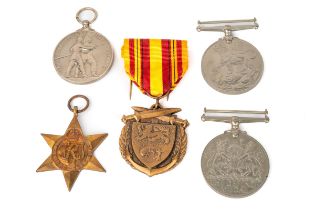 A WWII group of medals, including The 1939-1945 Star, Defence Medal, British War medal; a British