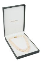 A three-row graduated cultured pearl necklace, with a 9ct yellow gold clasp, approx 42cm long Good