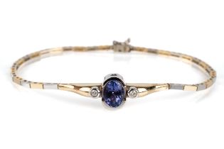 A 14ct bi-colour gold tanzanite and diamond bracelet, set with an oval cut tanzanite approx 1.07cts,
