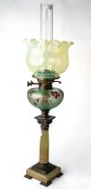 An Antique oil lamp with green alabaster column and etched cameo glass front, with Vaseline glass