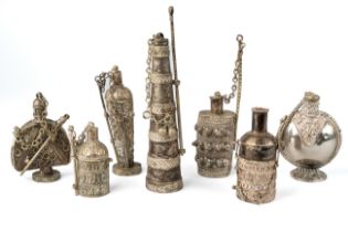 A collection of 7 white metal bottles, probably North African. Tallest 13.5 cm In good condition.