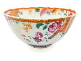 A Chinese famille rose bowl, wavy rim, enamelled with flowers and foliage, approx 14cm diam, 7cm