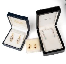 A pair of 18ct yellow and white gold drop earrings, each set with a diamond approx 0.05ct, post
