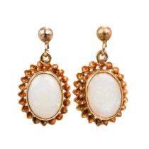 A pair of 9ct yellow gold and opal earrings, oval cabochon opals in rope-twist borders, post and