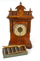 A nursery alarm clock with musical cylinder time tune player, with cylinders, approx 41cm high