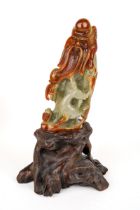 A Chinese carved jade figure, depicting an elder, approx 12cm high, approx 277g, boxed with