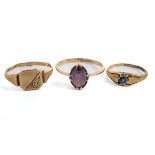 A 9ct yellow gold and amethyst ring, the oval mixed-cut amethyst in claw settings, knife-edge