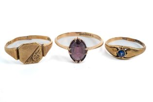 A 9ct yellow gold and amethyst ring, the oval mixed-cut amethyst in claw settings, knife-edge