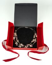 An Odessea freshwater pearl necklace, the button and potato pearls with purple, cream and silver