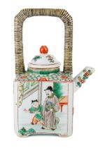 A Chinese famille vert teapot and cover, painted depicting figures, striped handle, approx 17.5cm